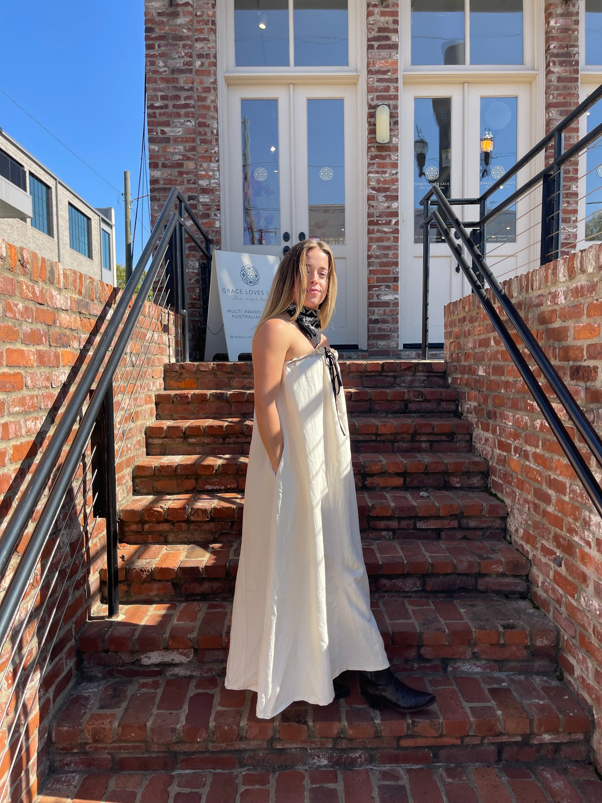 cream strapless maxi dress for women side profile relaxed fit